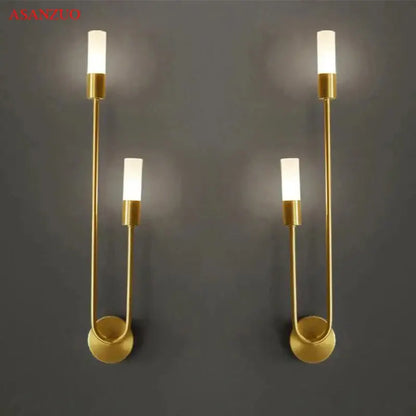 Gold-toned decorbites led candlestick wall light with sleek curved metal arms and frosted glass shades for indoor decor