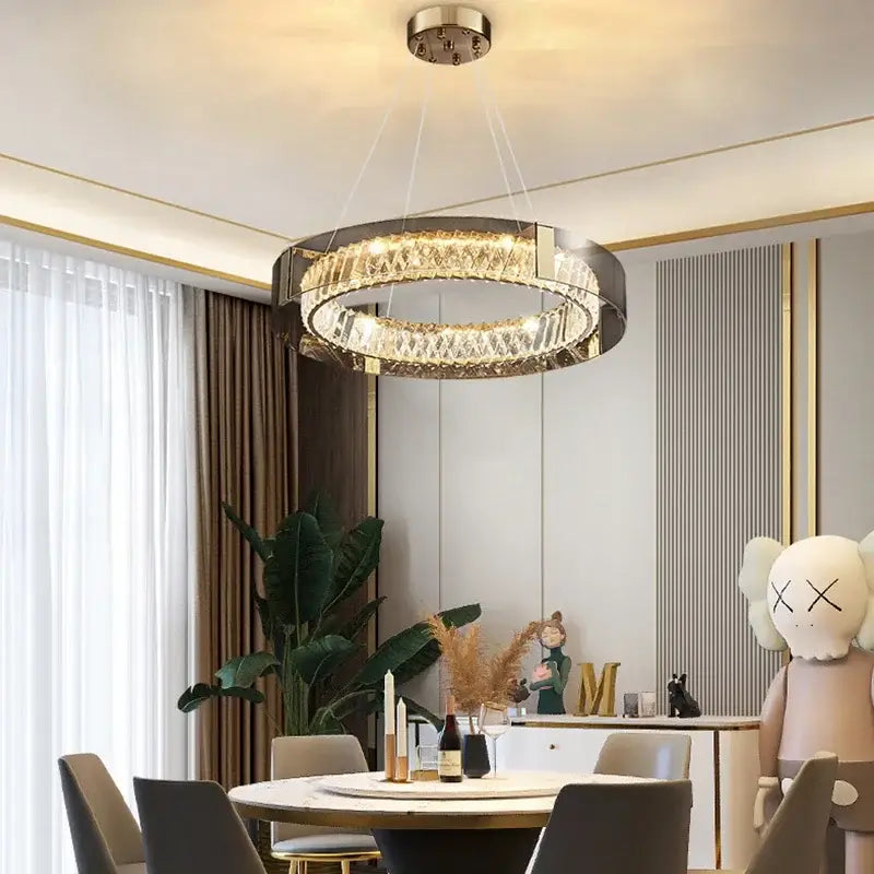 Modern circular DecorBites LED gold crystal glass chandelier with sleek metallic frame and sparkling crystal accents