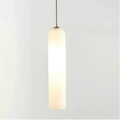 A sleek decorbites led green glass pendant light with a frosted glass shade and brass stem for kitchen bar decor