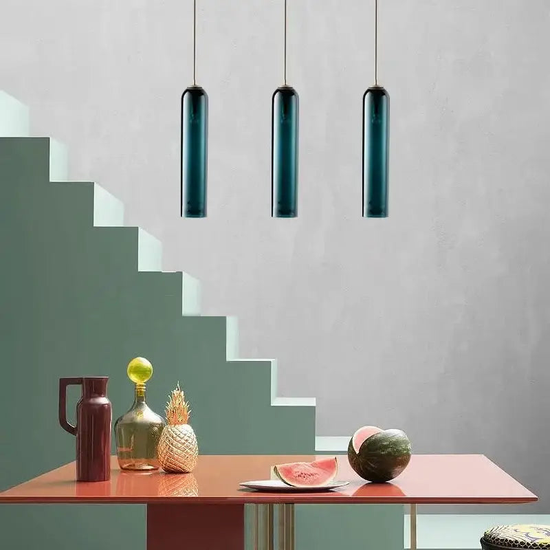 Three sleek dark teal cylindrical pendant light fixtures from decorbites led green glass series for kitchen bar decor