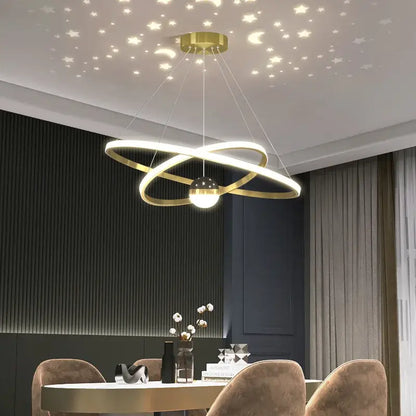 Gold-toned led gypsophila chandelier with intertwined rings and globe light casting starry patterns on ceiling