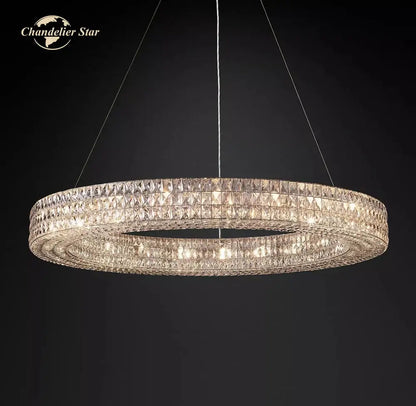 A double-tiered circular decorbites led halo crystal chandelier with faceted crystals suspended by thin wires against dark background