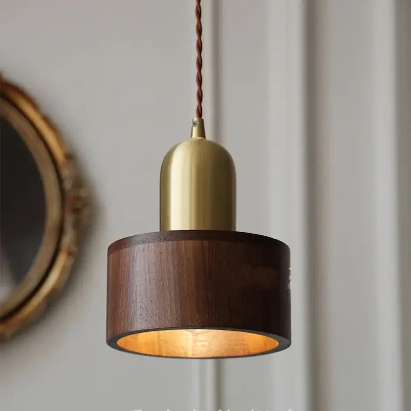 DecorBites led hanging lamp with warm copper brass top and dark walnut wood shade suspended by twisted cord