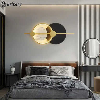 Modern gold-toned DecorBites™ LED home wall lamp with circular marble-effect face and black accent for living room lighting