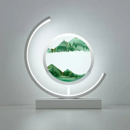 Modern crescent-shaped decorbites led hourglass quicksand desk lamp with glowing white frame and layered green sand landscape