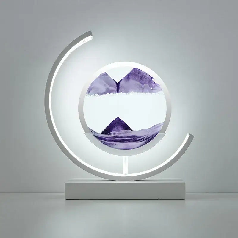 A modern white crescent-shaped decorbites led hourglass with glowing frame and purple mountain hourglass quicksand display