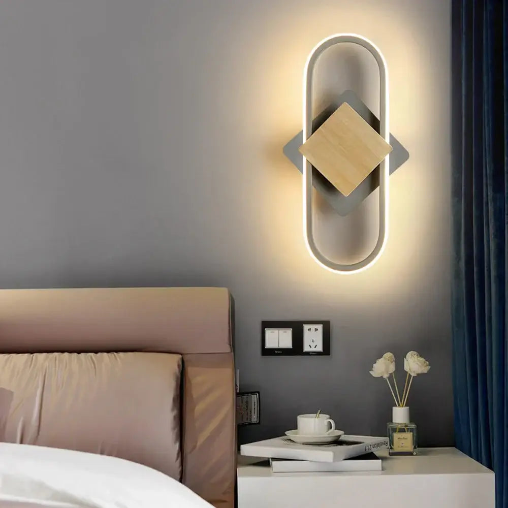 Modern decorbites led indoor wall light with sleek oval frame warm light and central wooden square accent for home lighting