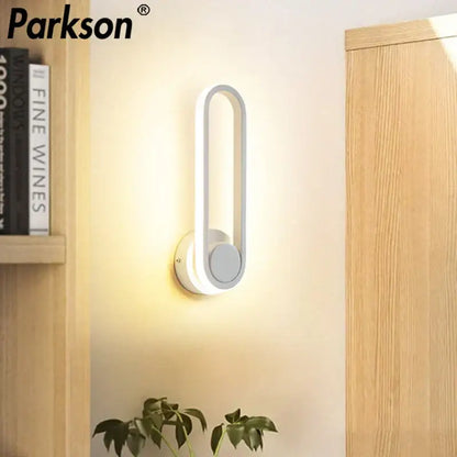 Modern white DecorBites LED indoor wall sconce lamp with sleek curved rectangular design for home bathroom lighting