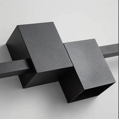 Black matte-finished geometric decorbites led interior wall lamp with angular cube shapes for modern minimalist lighting
