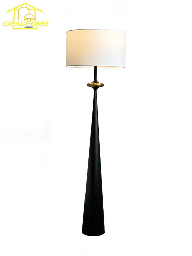 Black tapered floor lamp with white cylindrical shade and gold accent featuring decorbites led iron art design