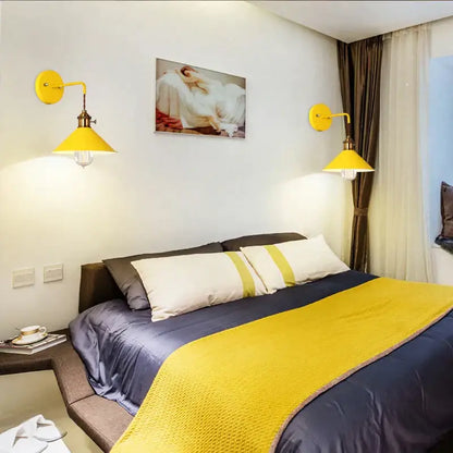 Pair of vibrant yellow decorbites led iron wall light with brass accents and conical shades for modern home decor
