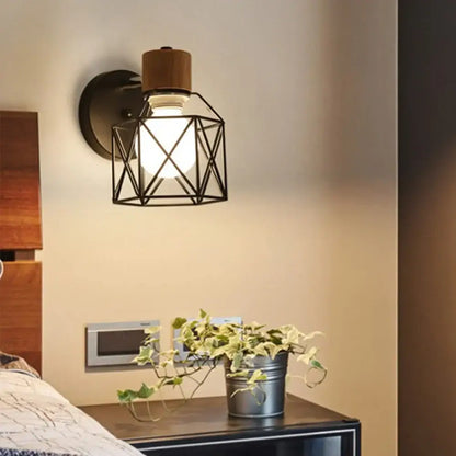 Industrial-style wall light with black metal geometric cage wooden top cap and exposed bulb by decorbites led iron cage