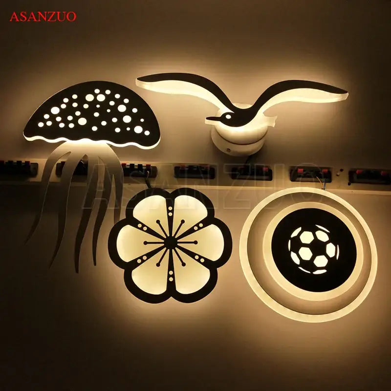 Set of four modern decorbites led jellyfish wall sconces with playful jellyfish, seagull, flower, and soccer ball designs
