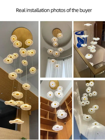 Modern white DecorBites LED lotus staircase chandelier with golden mount and cloud-like lampshades for hotel lobbies and villas