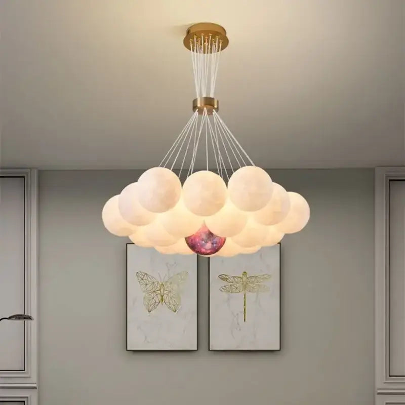 Cloud-shaped DecorBites LED Lunar ball chandelier with gold ceiling mount and frosted shades for home decor
