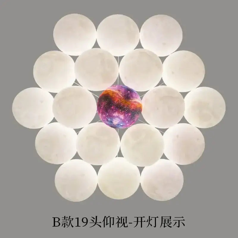 A glowing galaxy-patterned spherical light fixture with a ring of white orbs in decorbites led lunar chandelier