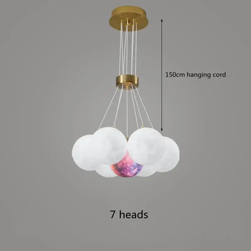 A modern decorbites led lunar ball chandelier with gold metal frame and seven glass orbs including one galaxy orb