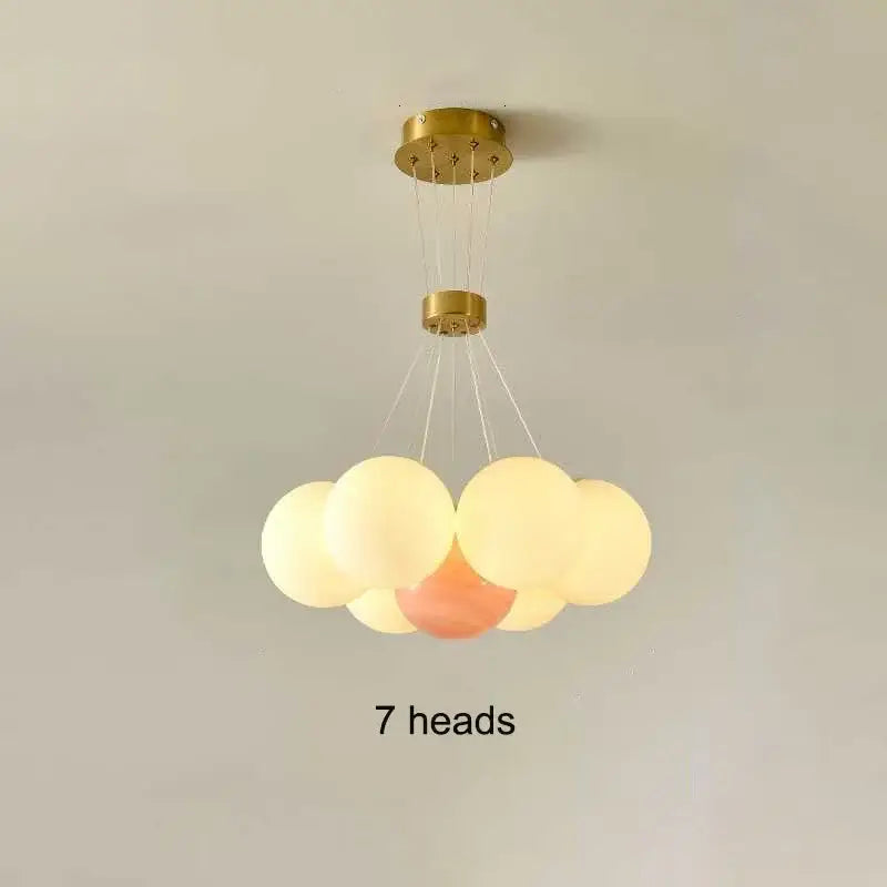 Gold-finished decorbites led lunar ceiling fixture with seven frosted glass orbs for living and bedroom lighting
