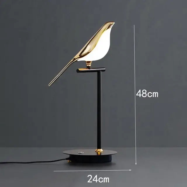 Gold-toned led magpie bird pendant light with sleek minimalist design on black metal stand by decorbites led magpie