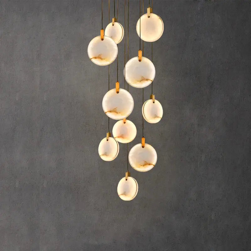 Modern chandelier with translucent white opal discs and gold-toned hardware decorbites led marble gold chandelier
