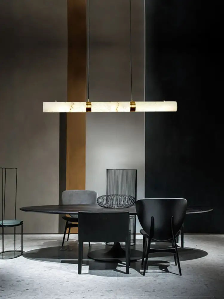 DecorBites™ led marble hanging lamps in white alabaster with gold accents above a dining table