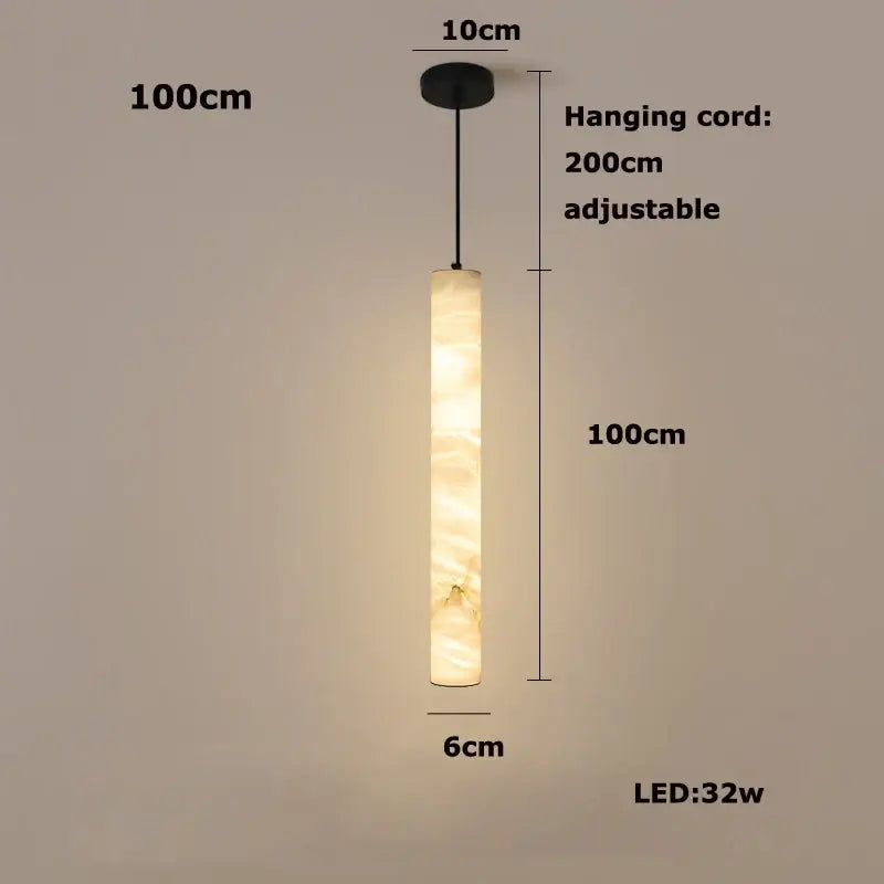 A warm cylindrical decorbites led marble hanging lamp in white alabaster with a soft amber glow