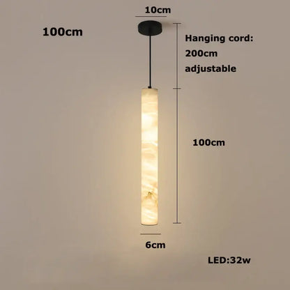 A warm cylindrical decorbites led marble hanging lamp in white alabaster with a soft amber glow
