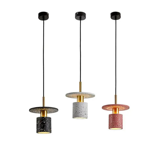 Three DecorBites led marble stone pendant lights with speckled concrete shades and gold-toned frames for dining room use