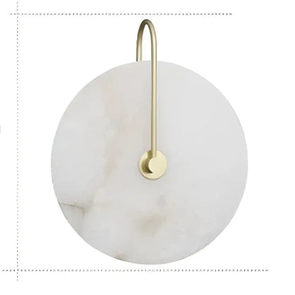 Decorbites led marble wall sconce featuring a circular white marble coaster with gold metal hook and ring for hanging