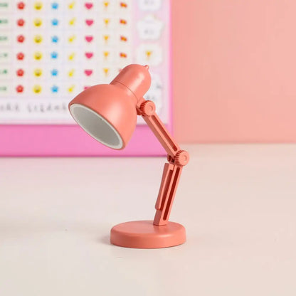 Coral-colored decorbites led mini desk lamp with adjustable arm foldable design and magnetic base for bedroom use