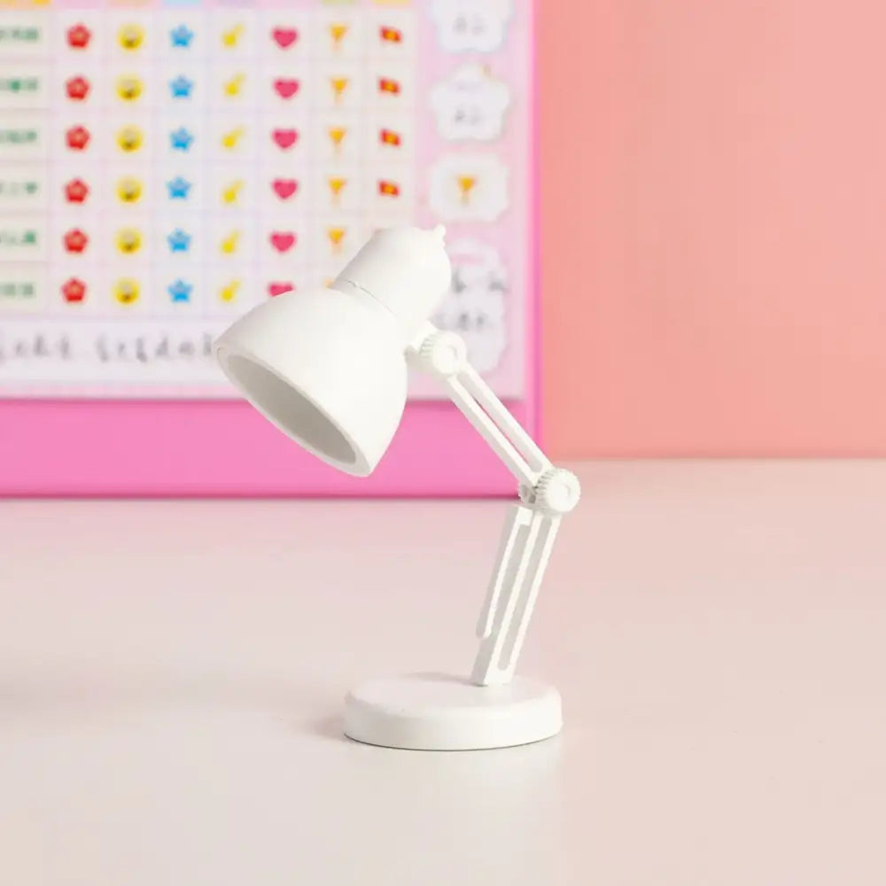White decorbites led mini desk lamp with articulated arm and circular magnetic base for study and night light use