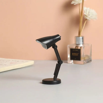 Black miniature decorbites led mini desk lamp with articulated arm, matte finish, clip, and magnetic base for study