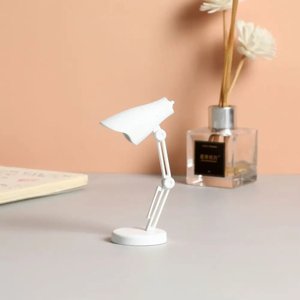 White decorbites led mini desk lamp with articulated arms foldable design and magnetic base for study and bedroom night light