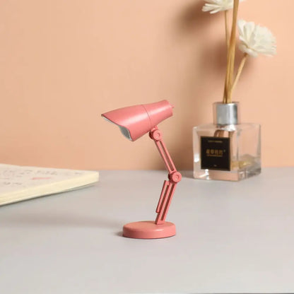 Pink decorbites led mini desk lamp with articulated arm, circular base, and eye protection for bedroom and study use