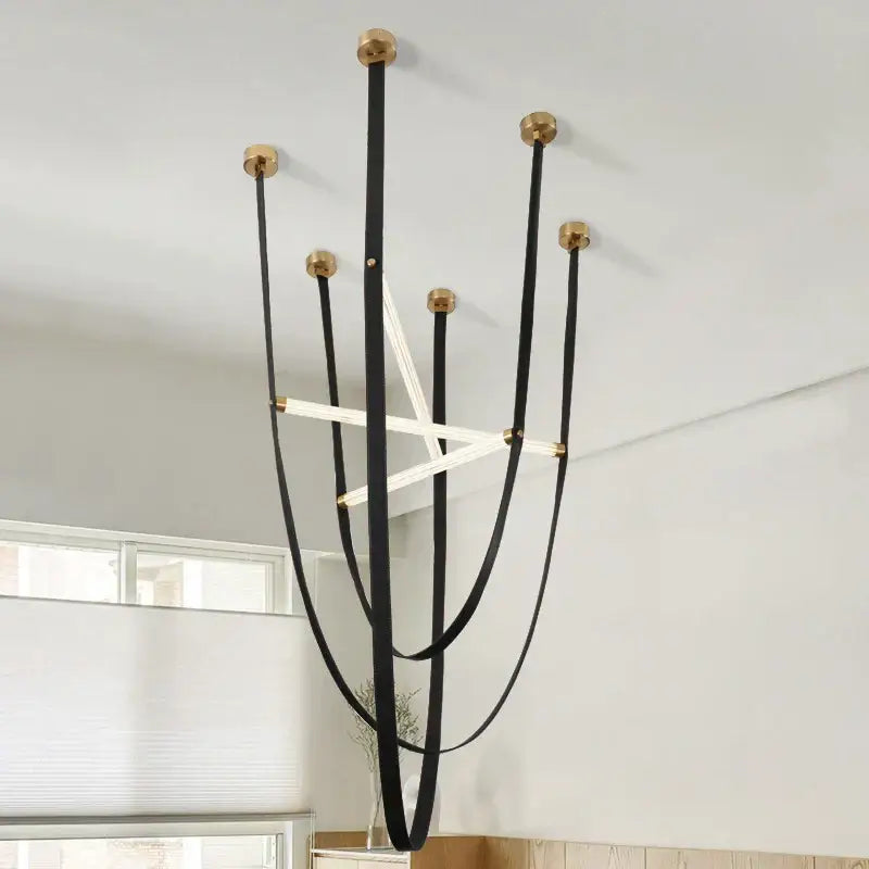 Black leather straps with gold metal caps form a decorbites led minimalist pendant lamp chandelier for living room decor