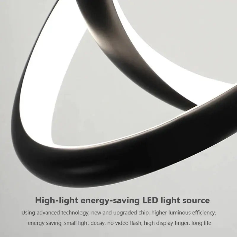 Black curved led minimalist pendant light fixture by DecorBites with sleek modern design for bedroom and living room decor