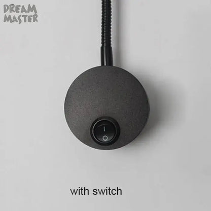 Black circular DecorBites LED mirror light bedside lamp with matte finish and integrated on/off switch for modern wall lighting