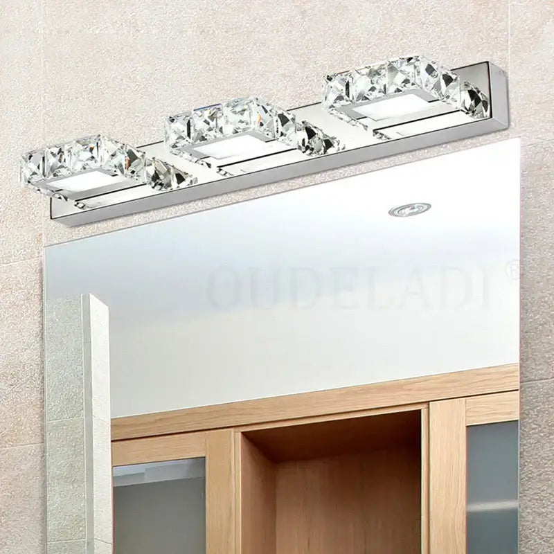 Chrome-finished DecorBites™ LED mirror wall lamp with three rectangular crystal-encrusted fixtures for bathroom vanity