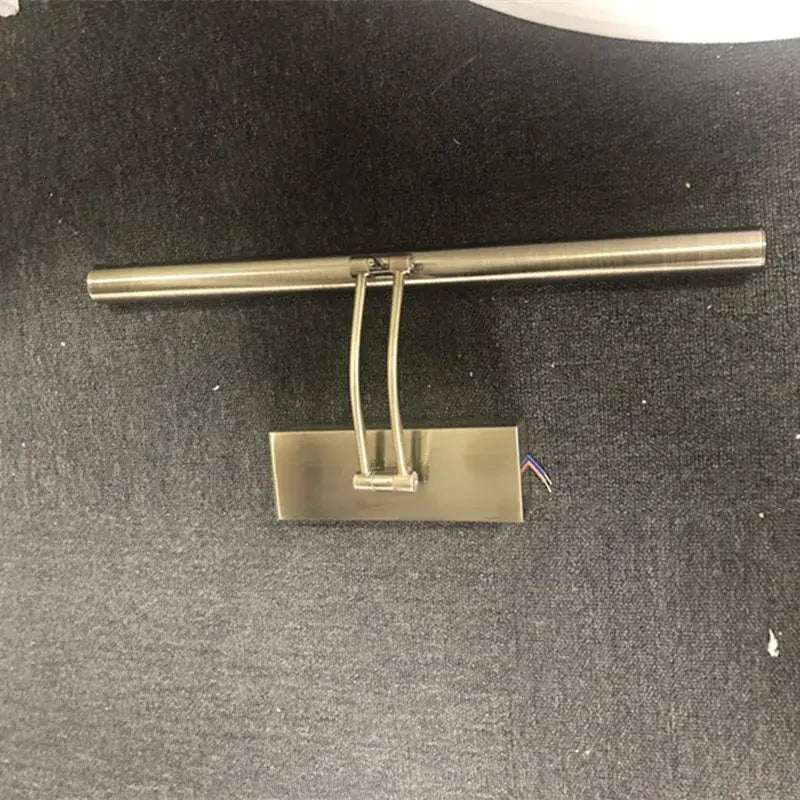 Brushed nickel finish led mirror light with sleek rectangular base and curved arm for bathroom wall decor by DecorBites