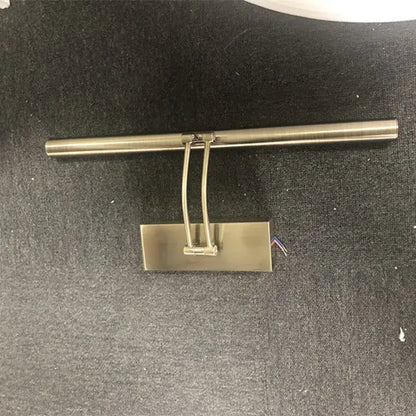 Brushed nickel finish led mirror light with sleek rectangular base and curved arm for bathroom wall decor by DecorBites
