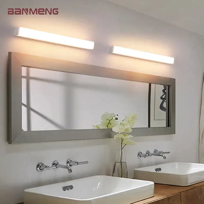 Two sleek modern warm white decorbites led mirror wall sconces mounted above a bathroom mirror for indoor lighting