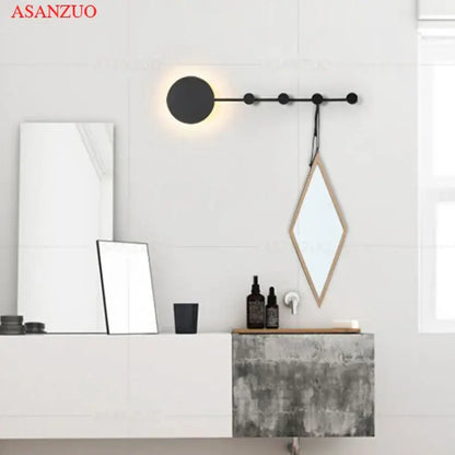 Black circular wall lamp with minimalist design and warm light emission decorbites led moon wall lamp for home ambiance