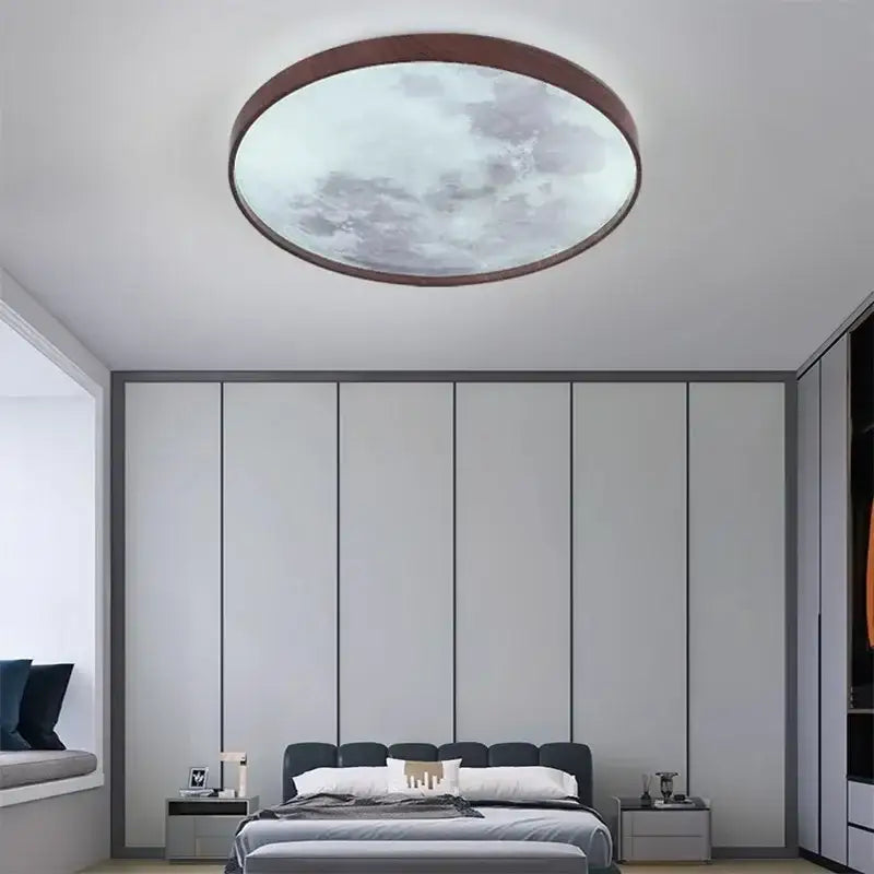 Circular decorbites led moon ceiling light with walnut wood frame and frosted glass panel showing a cloudy sky design