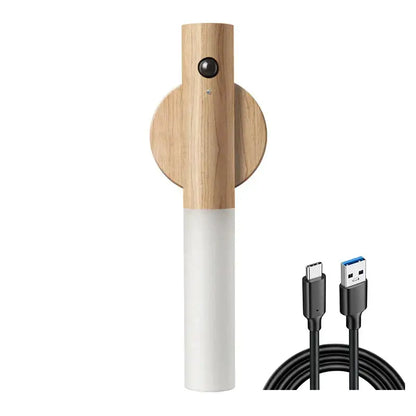 Wooden and white cylindrical DecorBites LED motion sensor night light with circular wooden base for bedroom closet
