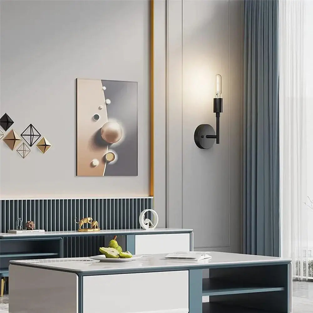 Black minimalist wall lamp with slender arm and exposed filament bulb in DecorBites led multihead mirror design