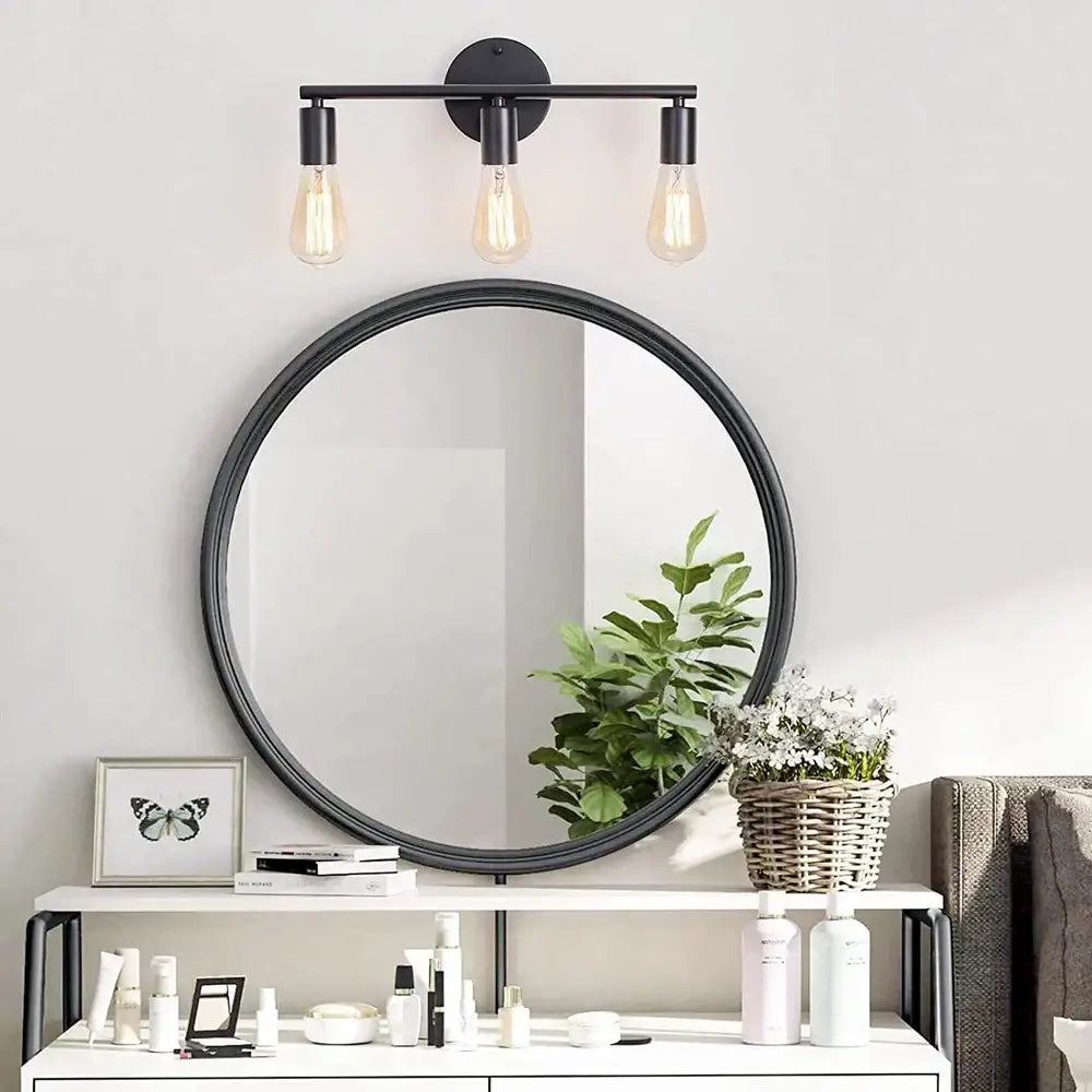 Black round mirror with sleek minimalist frame featured in decorbites led multihead mirror wall lamp vintage lighting