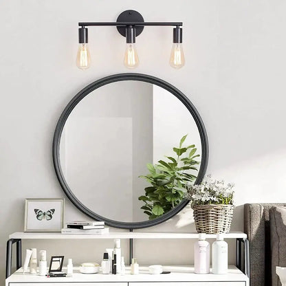 Black round mirror with sleek minimalist frame featured in decorbites led multihead mirror wall lamp vintage lighting