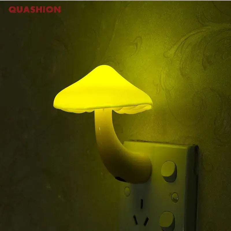 Yellow decorbites led mushroom night light with light-controlled sensor plugged into a wall outlet for bedroom use