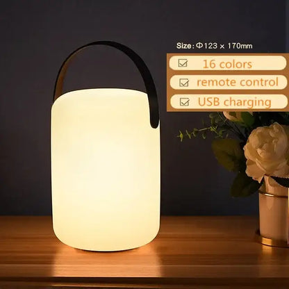A sleek white cylindrical led night light with usb charging and a black handle from decorbites for home and outdoor use