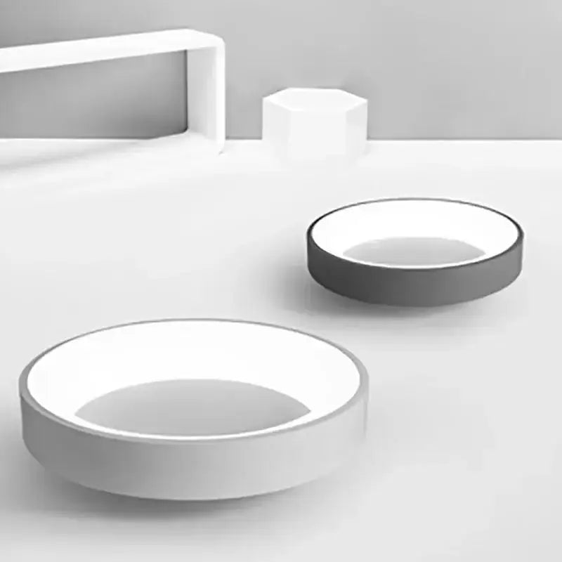White ceramic soap dish with black rim shown alongside decorbites led nordic ceiling light for modern home decor
